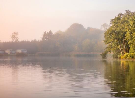 Misty Autumn sunrise over Pearl Lake