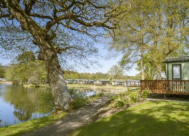 Lake edge caravan holiday home pitches at Pearl Lake