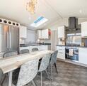 Willerby Vogue Nouveau for sale on lake edge pitch at 5 star caravan holiday park. Kitchen dining area photo
