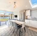 Willerby Vogue Nouveau for sale on lake edge pitch at 5 star caravan holiday park. Kitchen dining area photo